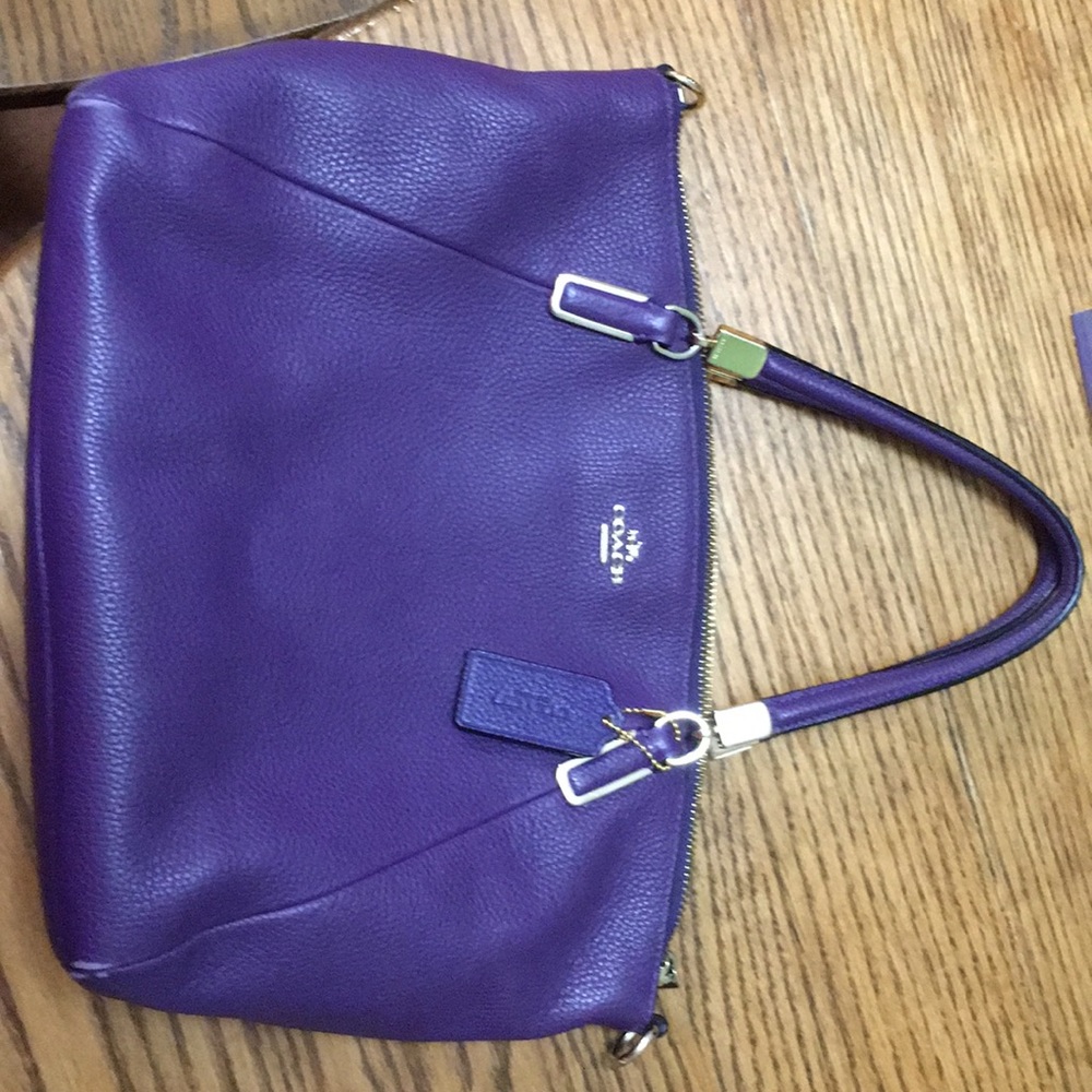 COACH crossbody, leather material.